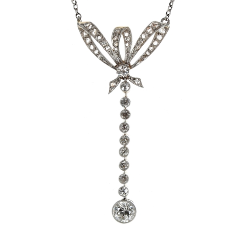 321 - Attractive antique old-cut diamond pendant on a slender white metal necklace, the pendant with a bow... 