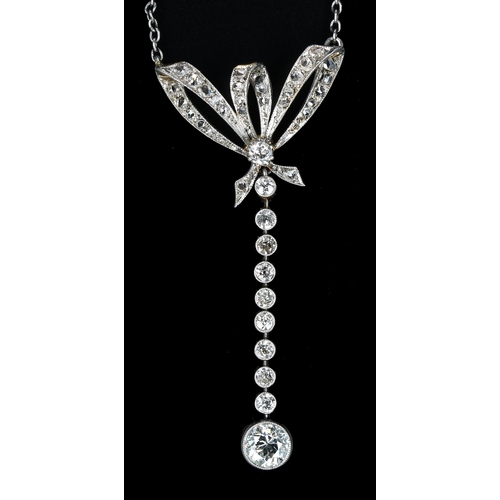 321 - Attractive antique old-cut diamond pendant on a slender white metal necklace, the pendant with a bow... 