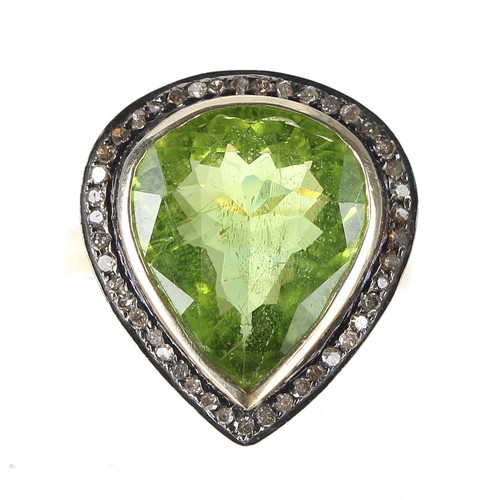 302 - Silver-gilt peridot and diamond pear shaped cluster, width 20mm, 5.9gm; with a silver yellow gem set... 