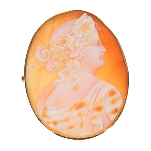 313 - Large oval shell cameo brooch depicting a portrait profile of a lady in a 9ct yellow gold rub-over m... 