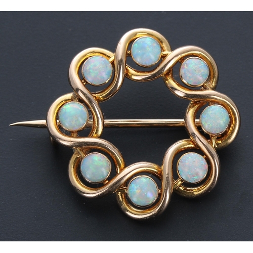 309 - Attractive 15ct circular opal set openwork brooch, set with eight cabouchon opals, 3.5gm, 25mm... 