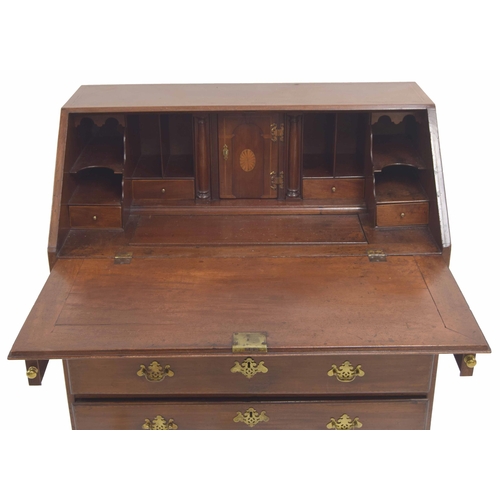 784 - George III mahogany bureau, the hinged fall front inlaid with an oval paterae enclosing a fitted div... 