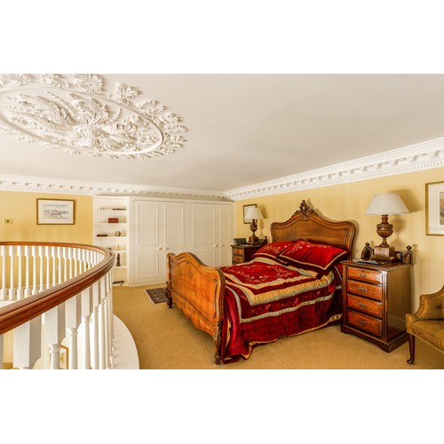 771 - Impressive French walnut carved double bed frame, the headboard with carved leaf scroll finial, rais... 