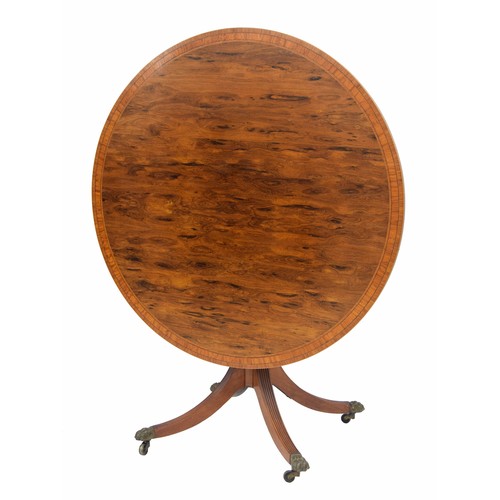 768 - Attractive Regency style rosewood circular tilt-top circular occasional table, crossbanded with a sa... 