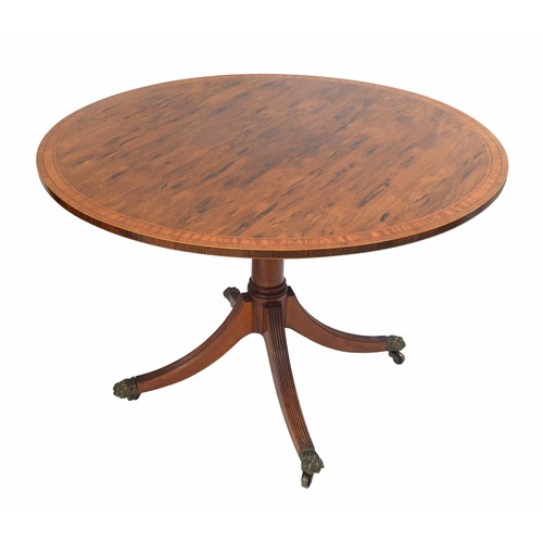 768 - Attractive Regency style rosewood circular tilt-top circular occasional table, crossbanded with a sa... 