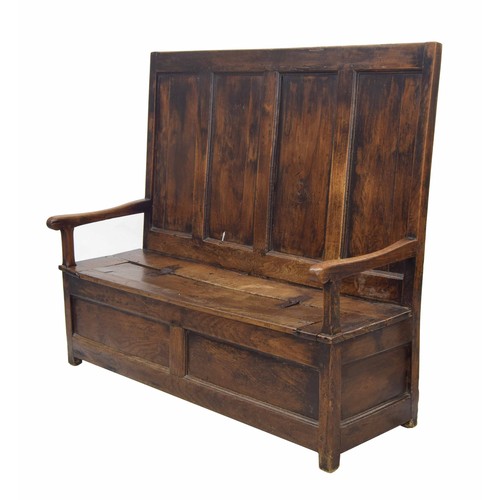 763 - Georgian oak and elm box settle, the four panel back over a hinged seat enclosing an open box beneat... 