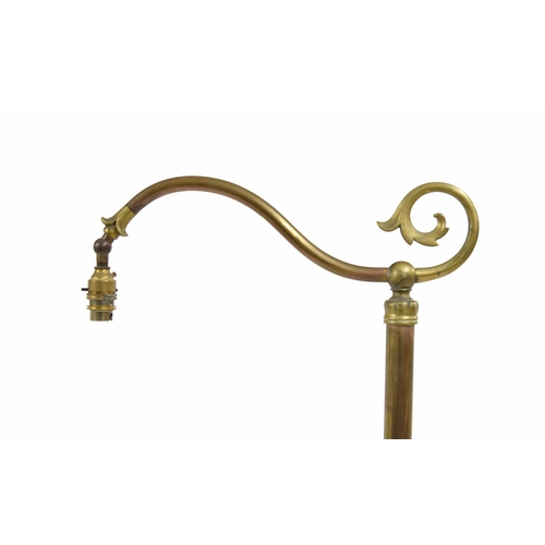 786 - Art & Crafts style brass standard reading lamp, on a trefoil base with cast paw feet, 65