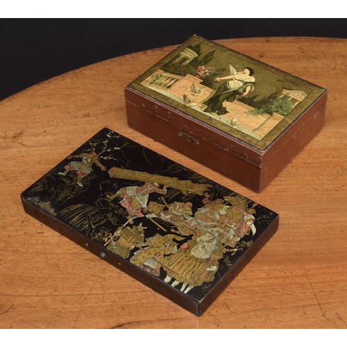 562 - Japanese lacquered papier mache box, the hinged cover with the transfer gilded image of a lumberjack... 