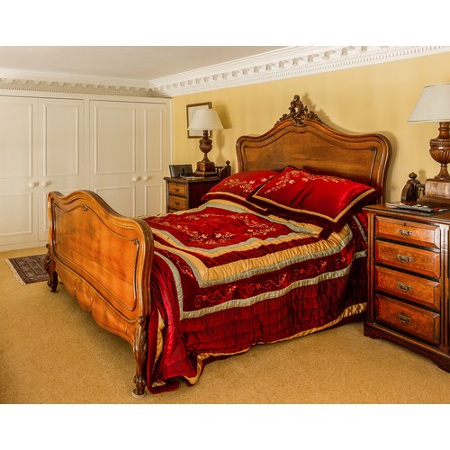 771 - Impressive French walnut carved double bed frame, the headboard with carved leaf scroll finial, rais... 