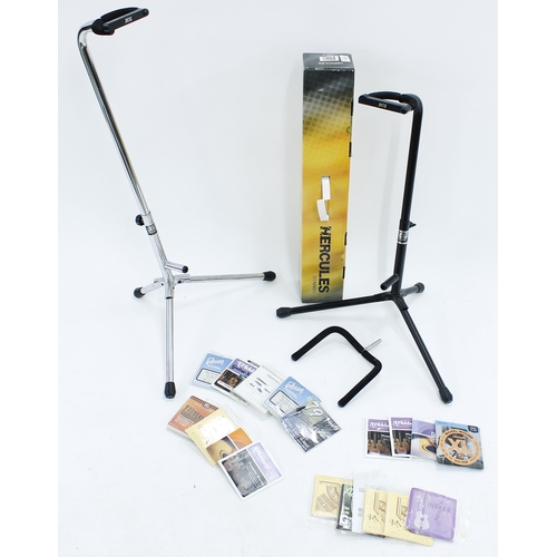 1103 - Hercules GS415B guitar stand, boxed; together with two further guitar stands and a selection of guit... 