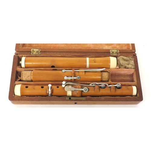 1848 - Boxwood and ivory flute by and stamped J. Wood, London, with eight silver keys on wooden blocks, cas... 