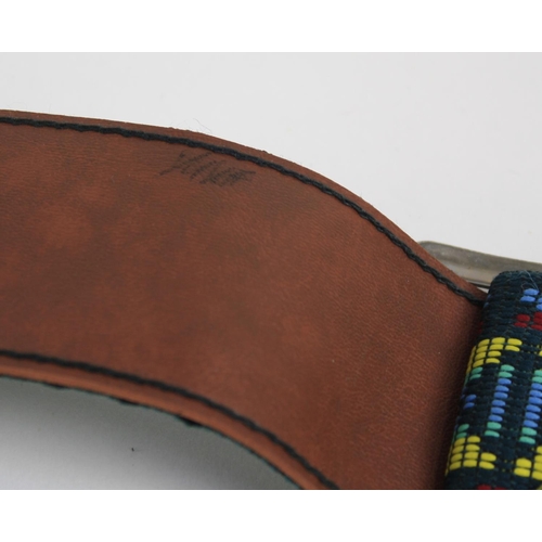 673 - Cat Stevens - a fabric guitar strap inscribed 'Rons will not put a message here' to the leather end,... 