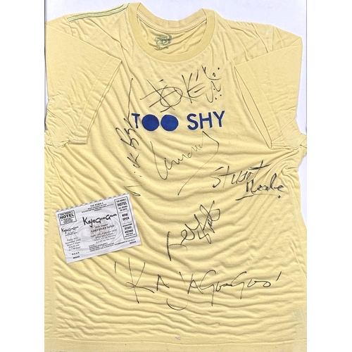 693 - Kajagoogoo - an autographed 'Too Shy' T-shirt, glazed and framed with a ticket for Kajagoogoo and No... 