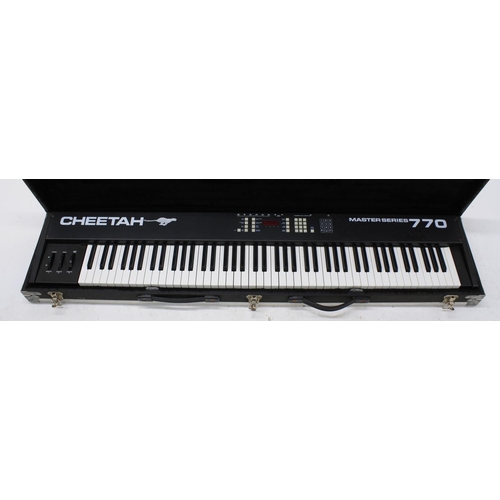 1336 - Cheetah Master Series 770 midi controller keyboard with weighted keys, within a fitted heavy duty fl... 