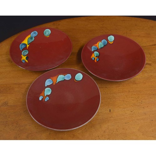 54 - Three Poole Pottery 'Odyssey' low bowls, with factory stamps to the undersides, 10.5