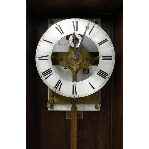 1103 - Oak electric longcase clock, bearing a rectangular brass plaque fixed to the inside back of the case... 