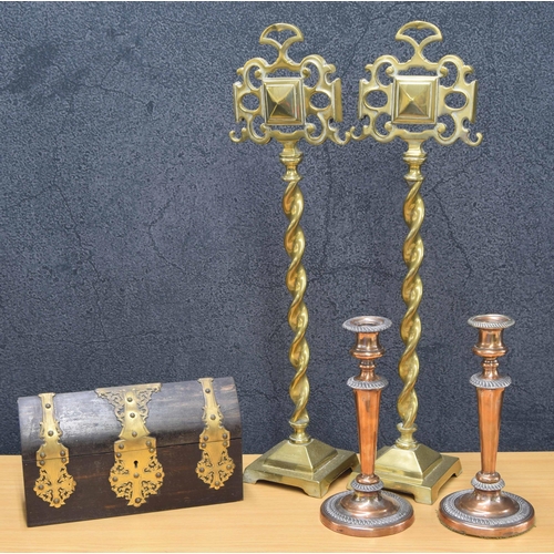 20 - Tall pair of brass andirons, raised on twist supports over square bases, with impressed registration... 