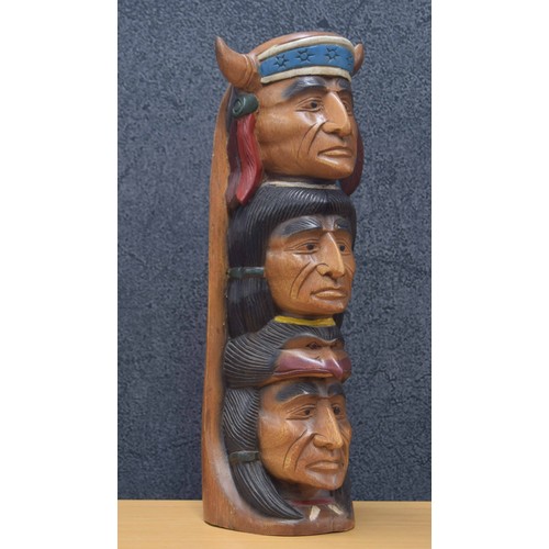 48 - Carved wooden native American totem pole, of three warrior figure heads, polychrome decorated, 20