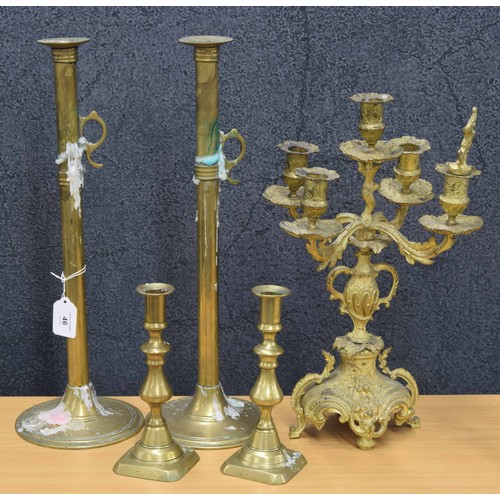 46 - Pair of tall Victorian brass pusher candlesticks on circular bases, 18