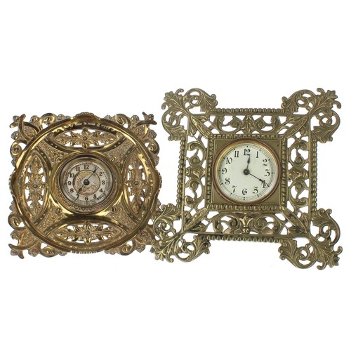 2505 - Two brass cased strut clock timepieces made by The British United Clock Company, both within pierced... 