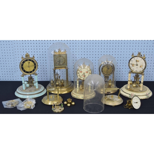 2117 - Five various torsion clocks with ball pendulums (three with domes); also a small quantity of torsion... 