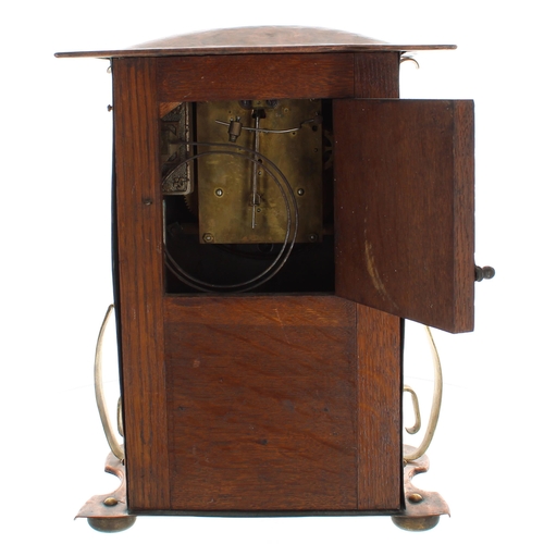 1524 - Art Nouveau oak, planished copper and brass clad two train mantel clock striking on a gong, the 5.5