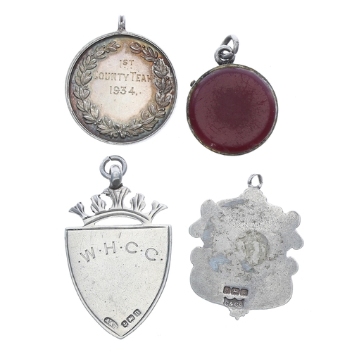 336 - Two silver medallion fobs; together with a silver mounted fob and a white metal fob (4)... 