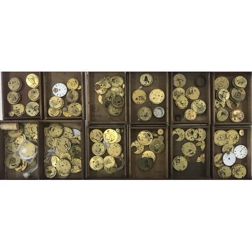 621 - Three trays containing a quantity of pocket watch movement parts; together with a twenty five drawer... 