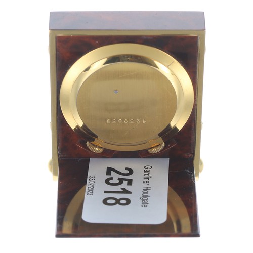 2518 - Good Jaeger-Le-Coultre folding miniature travelling alarm clock, within a brass and faux wooden case... 