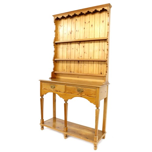 1181 - Tony Zemaitis - a pitch pine dresser, the three tier panel back delft rack over two short drawers an... 