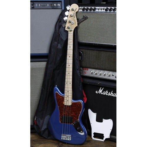 588 - Squire by Fender Jaguar bass guitar, made in China; Body: Lake Placid blue finish, heavy blemish to ... 