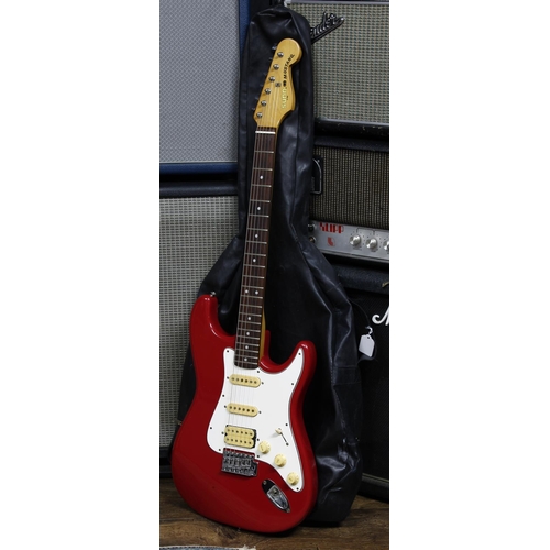 600 - Sunn by Fender Musical Instrument Corporation Mustang electric guitar, made in India; Body: red fini... 