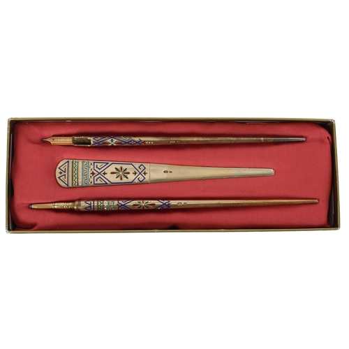 786 - Russian silver gilt and enamelled stationery set, comprising a letter opener, quill pen and pencil, ... 