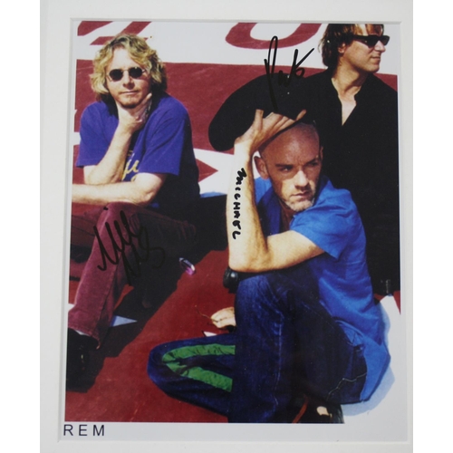 473 - REM - autographed coloured promotional photograph, glazed and framed, 13