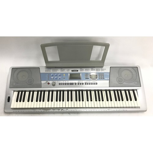 1295 - Yamaha DGX-200 portable grand keyboard, with stand*Please note: Gardiner Houlgate do not guarantee t... 