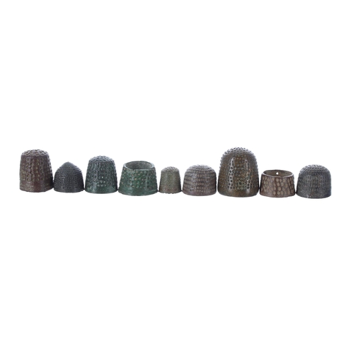 814 - Interesting mixed collection of Medieval bronze thimbles, the largest 23mm (9)