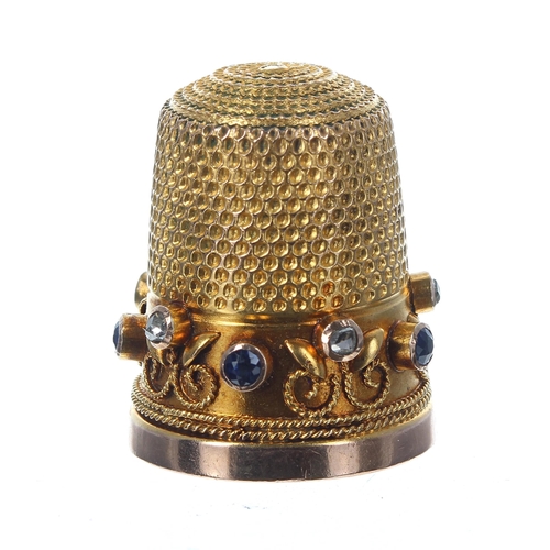 829 - Attractive 9ct diamond and blue gem set thimble, rub-over set with wirework decoration, 9gm, 22... 