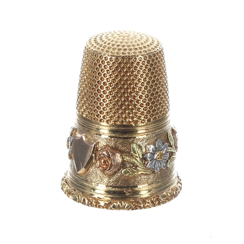 835 - Attractive antique multi-coloured gold thimble, with an ornate foliate band and vacant shield cartou... 