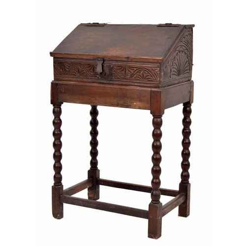 1328 - 17th century and later oak table writing box, with sloped hinged cover enclosing an open interior wi... 