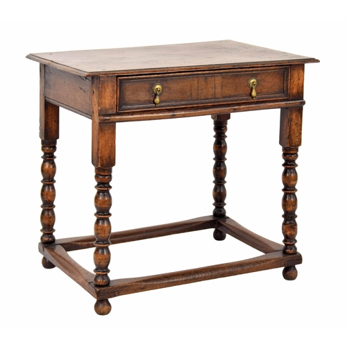 1334 - 18th century oak side table, the moulded top over a single drawer, raised on turned legs united by s... 