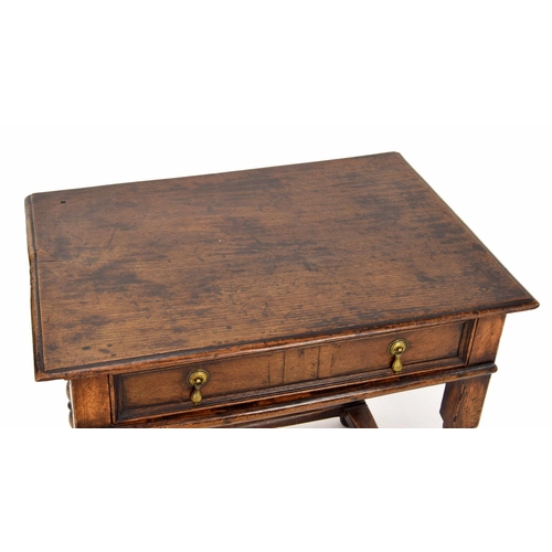 1334 - 18th century oak side table, the moulded top over a single drawer, raised on turned legs united by s... 