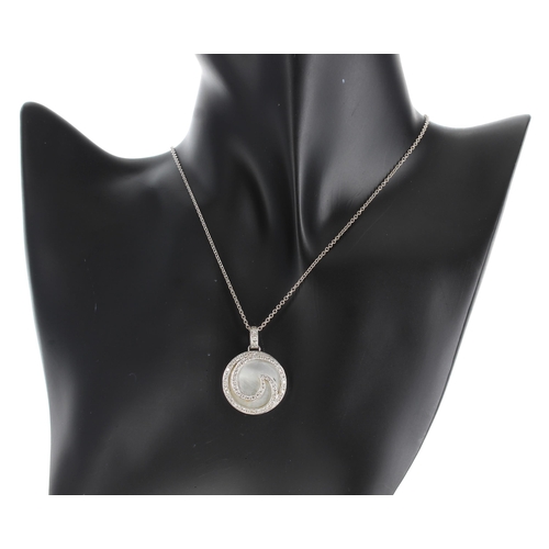 638 - Modern 18ct white gold diamond & mother of pearl swirl design circular pendant on necklace, 12.1... 