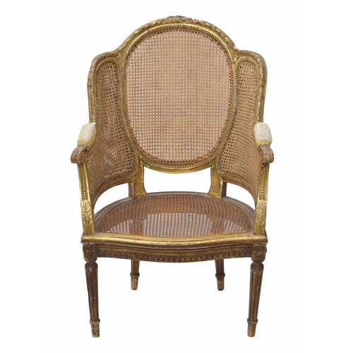 1340 - Louis XVI style gilt and bergere panelled chair, the back with carved harebell borders over back and... 