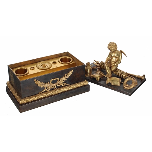 68 - French 19th century bronze and ormolu figural inkstand, the rectangular cover mounted with a winged ... 