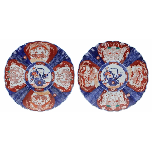 264 - Three similar Japanese Imari fluted porcelain wall chargers, each with foliate designs in typical pa... 