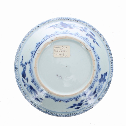 301 - Two similar Chinese export blue and white porcelain Patty Pans, each decorated with flowers and inse... 