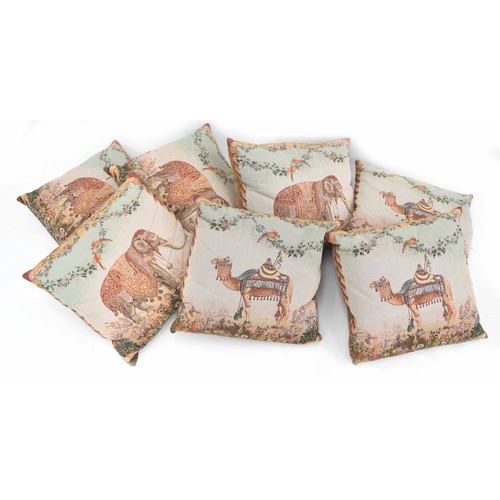 476 - Seven decorative cushions, five decorated with elephants in Indian processional dress, within dense ... 