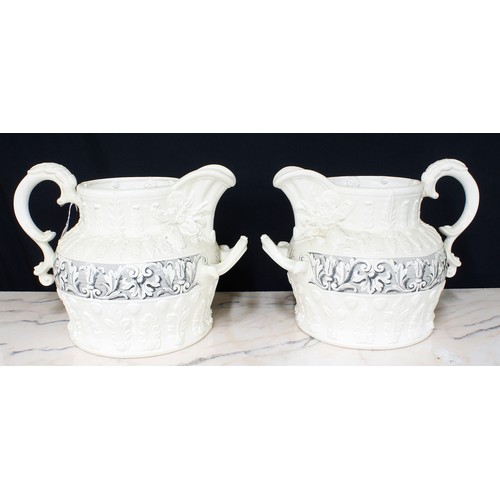 150 - Pair of large antique style relief moulded water jugs, with two handles and acanthus leaf decoration... 