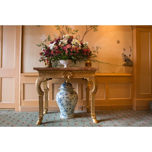 567 - George I giltwood side table in the manner of James Moore, the breche violette marble top over a car... 