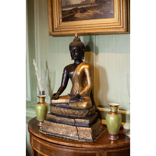 329 - Large decorative bronze Tibetan Buddha, cast seated, raised upon a stepped shaped plinth with gilt h... 